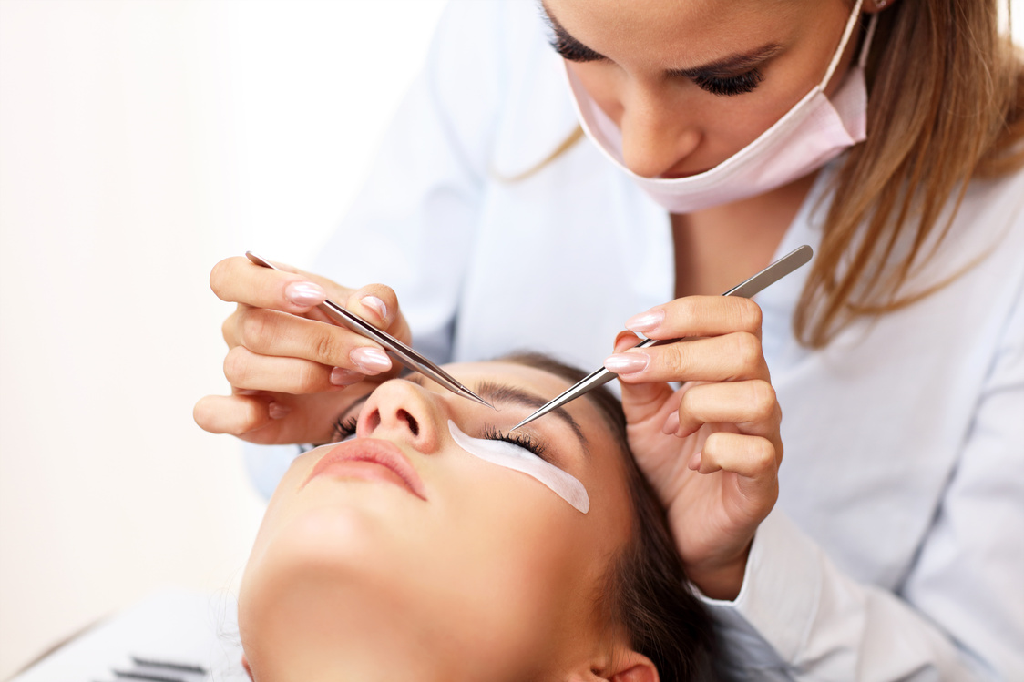 Adult Woman Having Eyelash Extension in Professional Beauty Salon